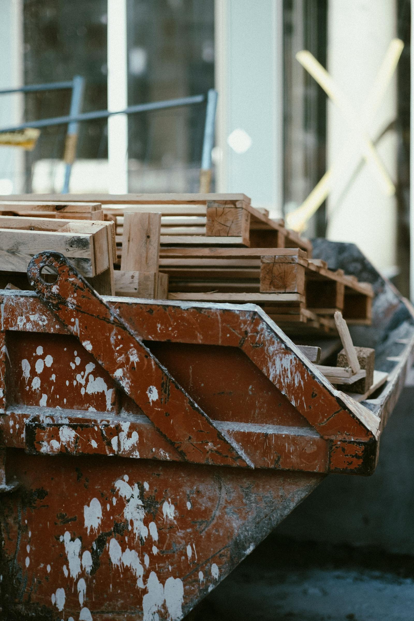 Builder's skip filled with timber on a Tameside street